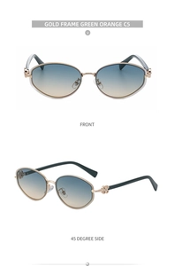 Detailed view of gold frame oval sunglasses with gradient lenses and clover detail