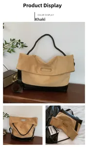 Detail of khaki suede tote bag with woven rope handles and black leather splicing
