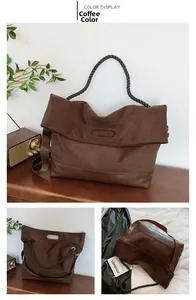 Detail view of coffee brown tote bag with green woven handles and textured suede material