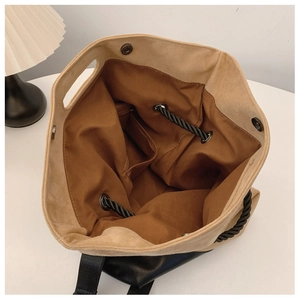 Internal view of large khaki tote bag showing spacious brown lining and magnetic closure