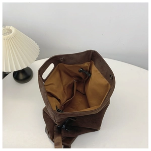 Top view of deep brown tote bag interior with ginger lining and internal zipper pocket