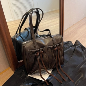 Retro chocolate brown shoulder bag with pleated pockets and delicate bow ribbons