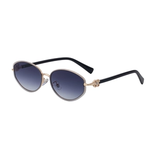 Oval gradient sunglasses for women with golden metal frames and clover flower hinges