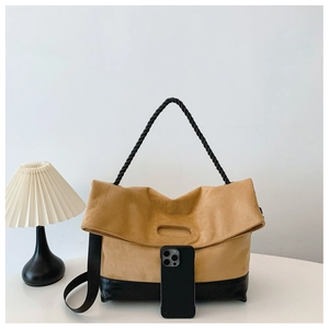 Detail showing the large capacity tote bag with a khaki matte finish and woven rope handle