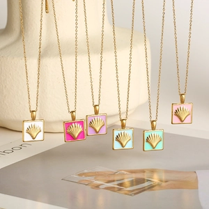 Detail of colorful enamel scallop shell square pendants on gold necklaces in six colors