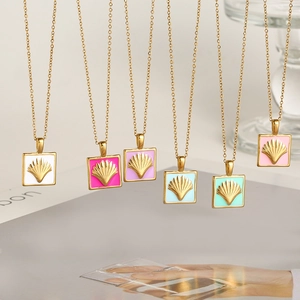 Detail of six colorful enamel square scallop shell necklaces with golden chains