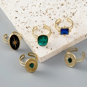 Vintage gold plated adjustable ring set featuring colorful gemstones and star motifs
