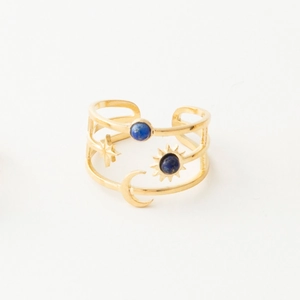 Detail of gold astronomical ring with star moon motifs and navy blue turquoise stones