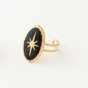 Detail of 18k gold plated ring with black enamel oval face and star motif