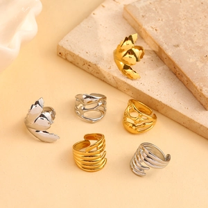 Set of 6 gold and silver adjustable rings with leaf and abstract hollow designs on stones