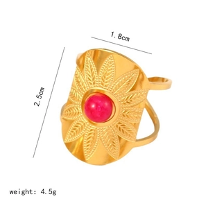 Detailed view of gold sunburst ring with red bead center and 2.5cm height dimension
