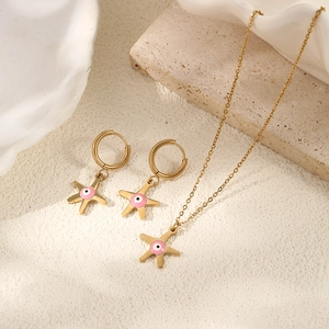 Golden stainless steel starfish necklace and earrings set with pink evil eye charm
