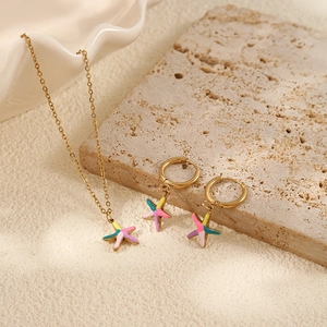 Golden stainless steel starfish necklace and earrings set with colorful enamel details