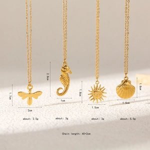 Detail of four gold ocean pendants with seahorse and starfish, chain length 40+2cm