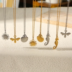 Golden and silver stainless steel ocean necklaces with sun, bee and seahorse pendants