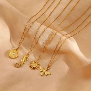 Gold stainless steel ocean necklaces set featuring shell seahorse sun and dragonfly pendants