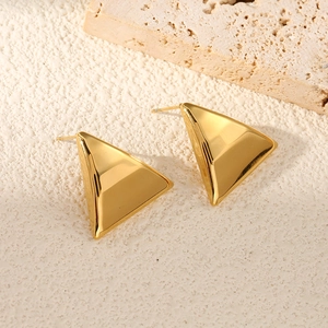Polished 18k gold plated stainless steel triangle stud earrings on a natural stone base