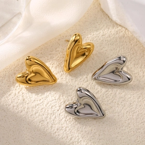 Minimalist irregular heart stud earrings set in gold and silver with liquid metal finish