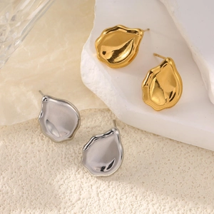 Minimalist irregular heart stud earrings in gold and silver finish with textured metal
