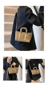 Three-way view of a khaki matte leather mini Boston bag worn by a model in a city setting