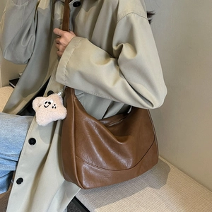 Brown large capacity tote bag in matte PU leather with a cute plush star charm