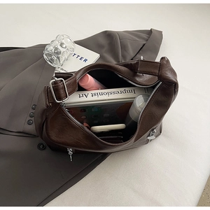 Interior view showing the large capacity of this vintage dark brown faux leather tote bag
