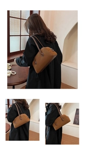 Detail view of brown suede Boston bag featuring soft matte texture and leather shoulder straps