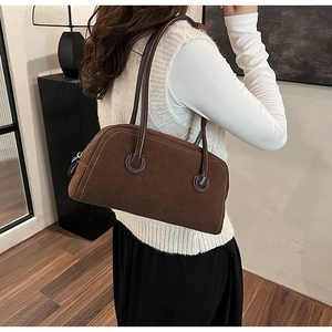 Vintage brown suede Boston handbag for women featuring white contrast stitching and long straps