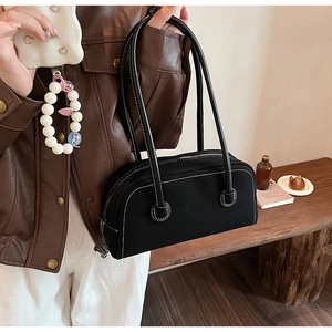 Retro black suede Boston handbag with white stitching and long shoulder straps
