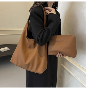 Detail shot of brown lychee texture tote bag set with matching zipper pouch