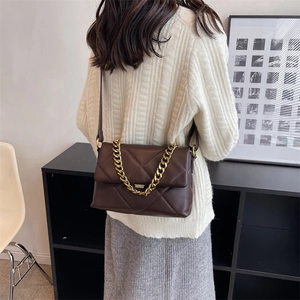 Quilted dark brown leather shoulder bag with gold chain and adjustable strap