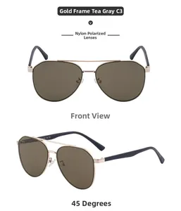 Dettaglio di occhiali da sole aviator dorati con lenti in nylon marrone polarizzate