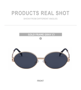 Front view of oval sunglasses with gold metal frame and dark gray lenses, style C1