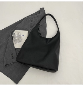 Detailed top view of a black pebbled leather large Hobo tote bag for women's daily commute
