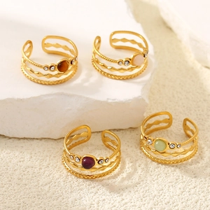Set of four gold-plated hollow rings with colorful natural stones and zircon accents