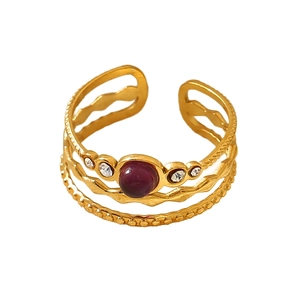 Vintage gold hollow multilayer titanium steel ring with red stone and rhinestones