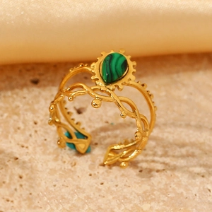 Detail of vintage 18k gold-plated twisted ring featuring a water drop malachite stone