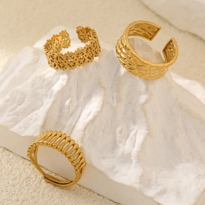 Three-piece set of adjustable gold stainless steel rings with floral and ribbed designs