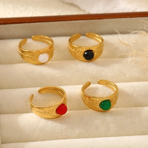 Set of four vintage 18K gold plated stainless steel rings with colorful gemstones