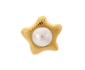 Detail of gold starfish earring with textured metallic surface and center pearl