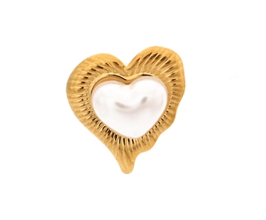 Close-up of heart-shaped pearl earrings with gold pleated texture and vintage style