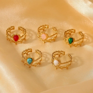 Detailed view of five vintage 18K gold-plated rings with colorful heart-shaped stones