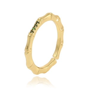 Detailed close-up of golden bamboo-shaped ring with four emerald green zircon stones