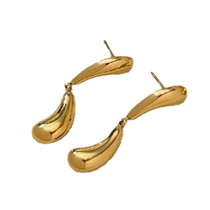 Minimalist golden teardrop earrings with high-polish mirror finish on a plain white background