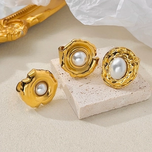 French vintage gold-plated lava ring set with white pearls on a stone display