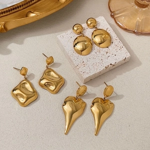 Three pairs of elegant gold textured earrings in square and round shapes for women