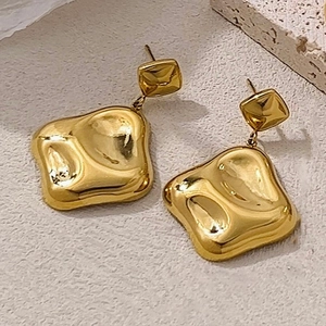 Minimalist gold square stud earrings with irregular lava texture and metallic glossy finish