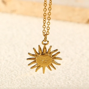 Minimalist gold stainless steel sun face pendant necklace with a polished sunburst design
