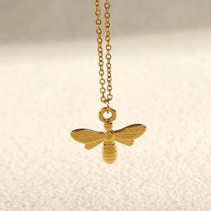 Golden honey bee pendant necklace made of stainless steel with a fine O-chain link