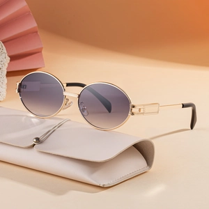 Retro oval sunglasses with gold metal frame and gradient purple lenses for women